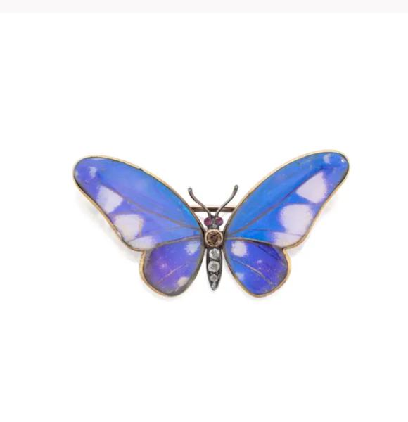 Ernst Paltscho. An early 20th century butterfly brooch, with ruby eyes, diamond and brown...
